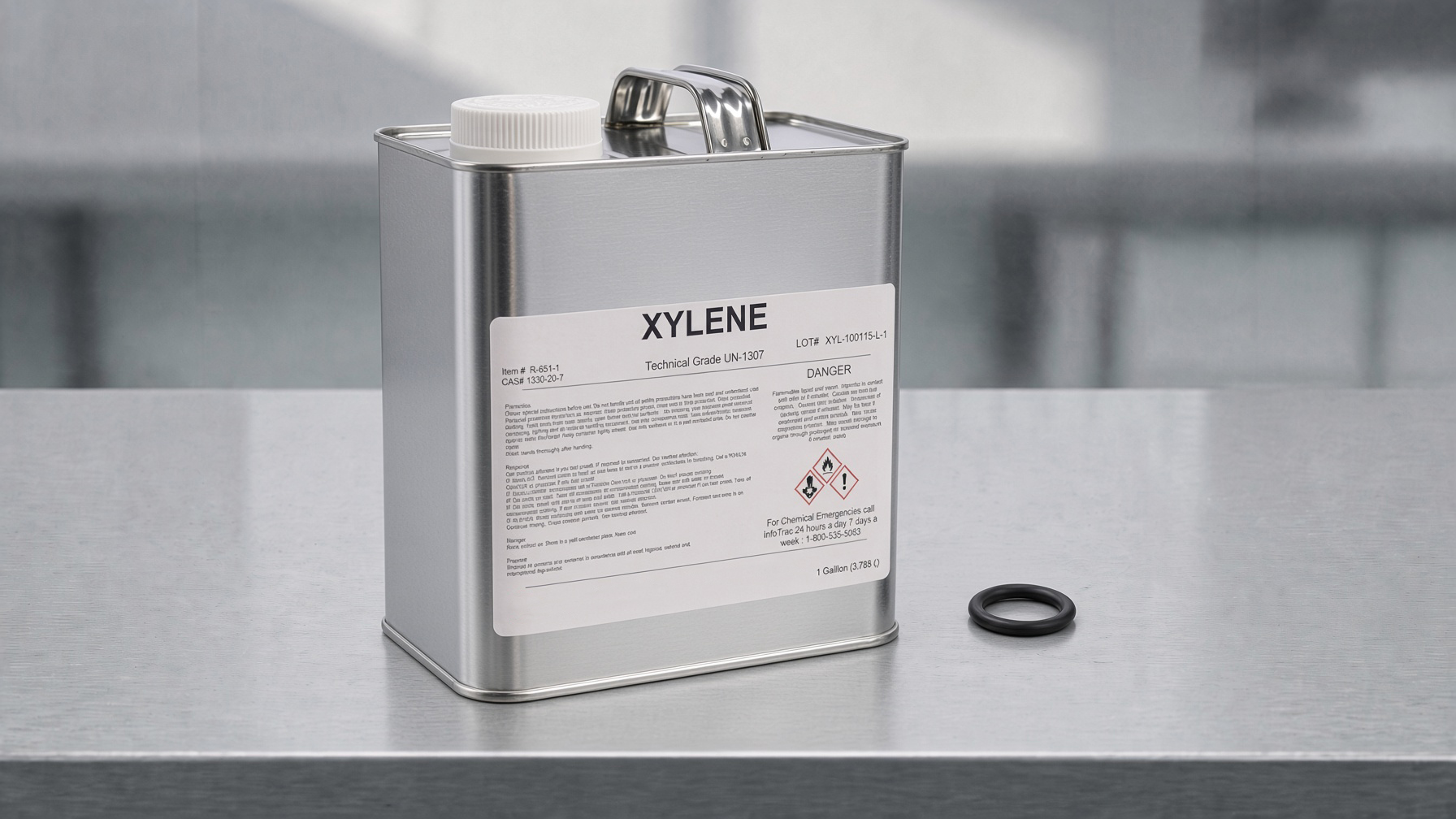 Black rubber O-Ring on frosted glass beside an amber bottle of xylene
